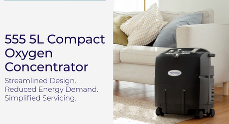 A black DeVilbiss 555 5L Compact Oxygen Concentrator shown in a living room setting next to a white sofa, with text on the left describing its features.